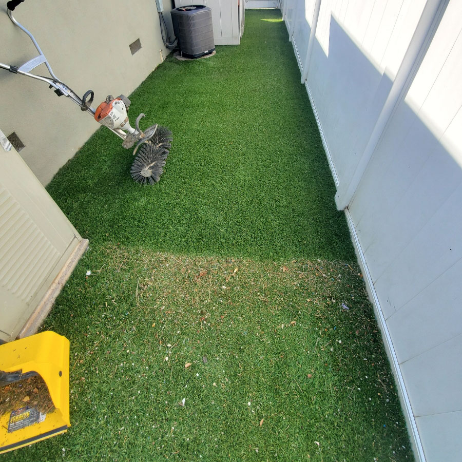 Before-_-After-comparison-of-side-yard Image Alt Tag Generator said: Artificial turf side yard being cleaned with power broom to remove debris and restore appearance.