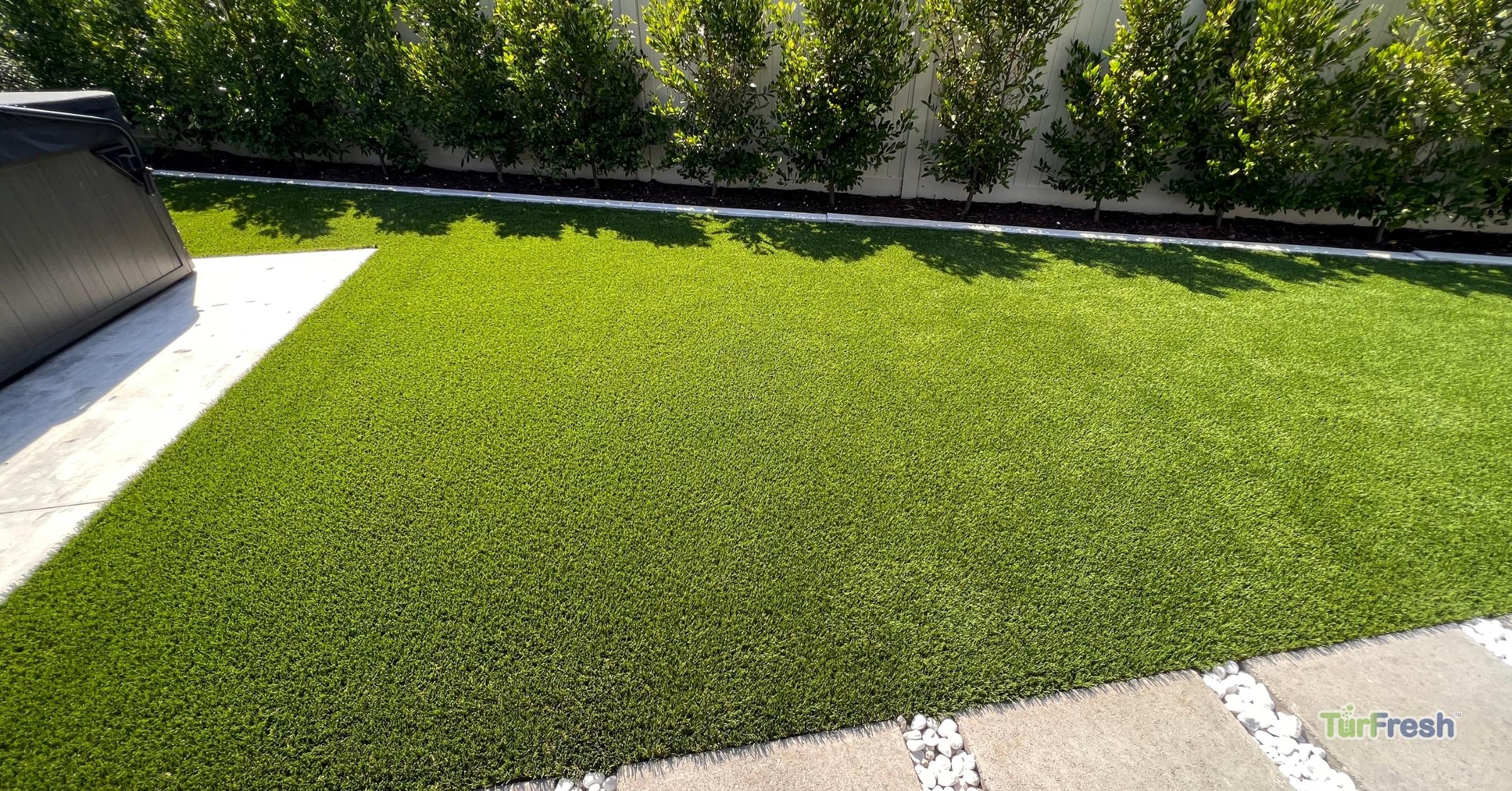 TurFresh Artificial Turf Cleaning – Backyard Turf Refresh and Maintenance Artificial turf backyard cleaned and brightened after TurFresh artificial grass maintenance service