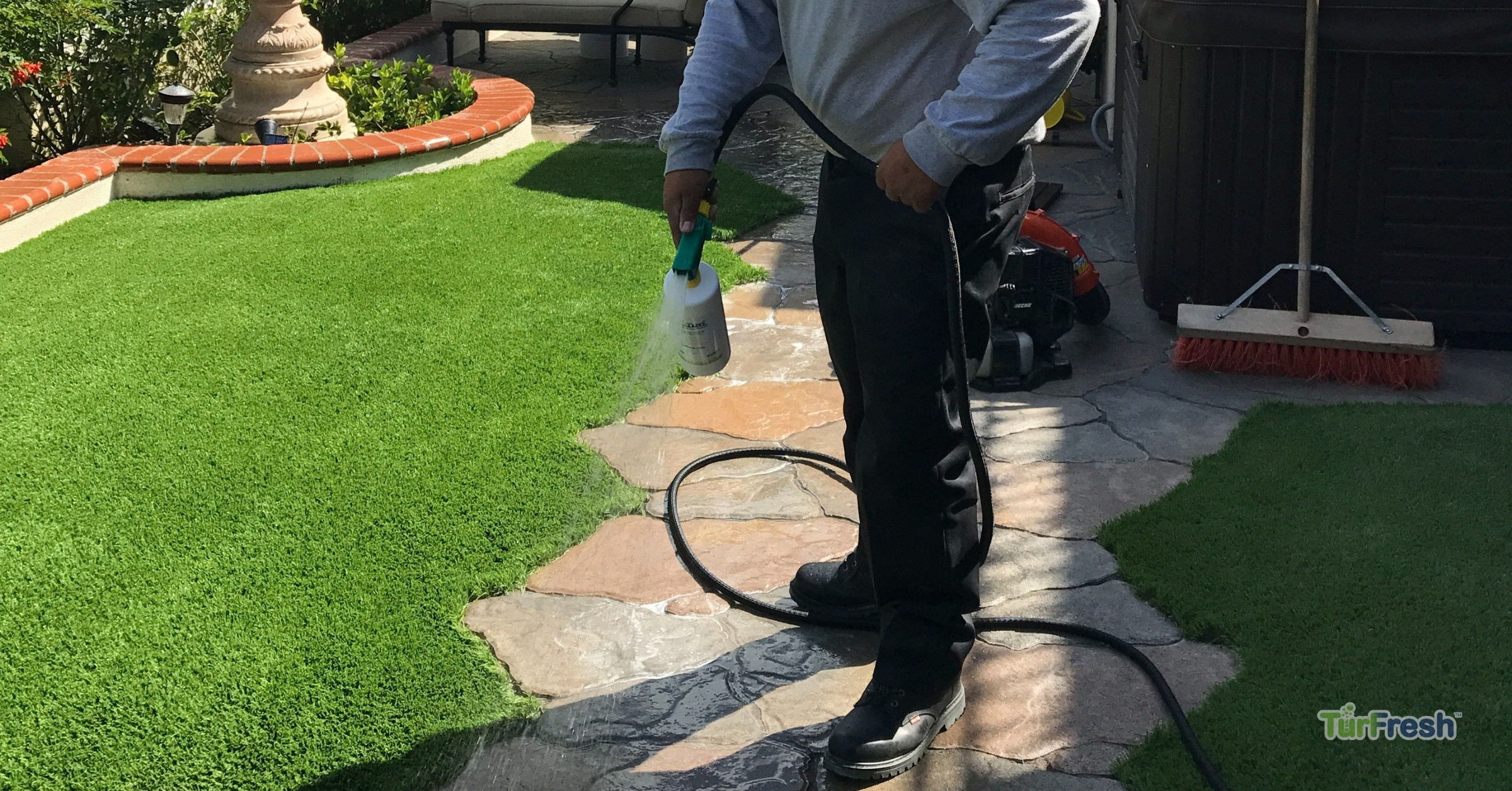 TurFresh Artificial Turf Cleaning Service – Professional Turf Odor Removal & Maintenance TurFresh professional applying turf cleaning solution on artificial grass to maintain odor control and freshness