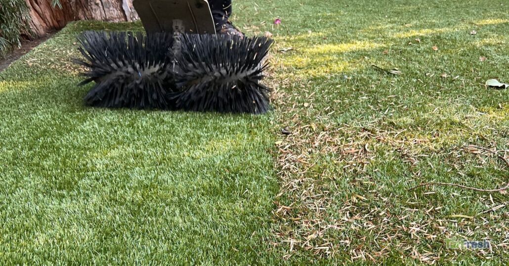 Turf brush machine restoring synthetic grass during cleaning service