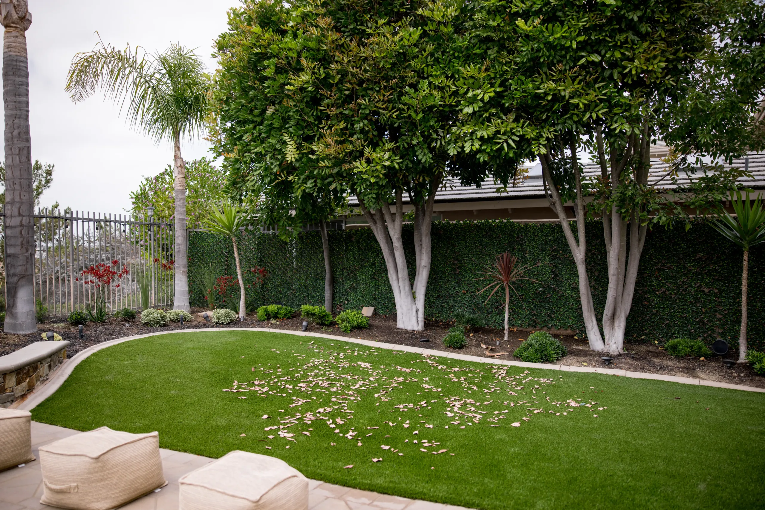 Artificial Turf Maintenance Cleaning Service by TurFresh Technician spraying artificial turf maintenance cleaning at job site